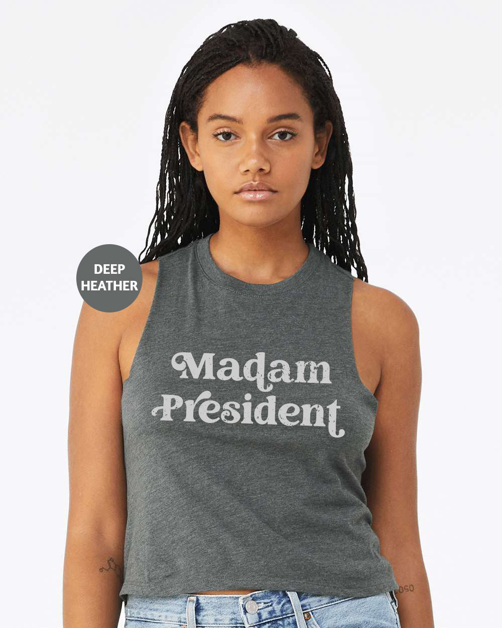 a woman wearing a tank top that says madam president