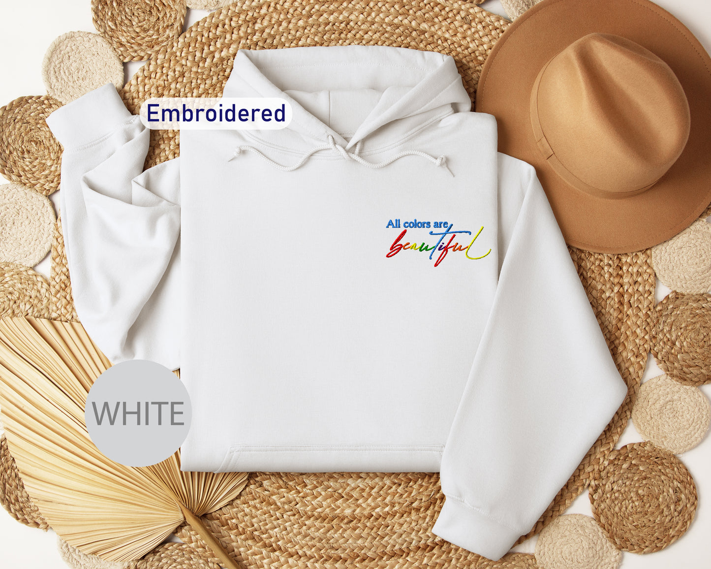 a white hoodie with the words embroidered on it