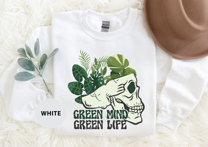 a white shirt with a green mind on it