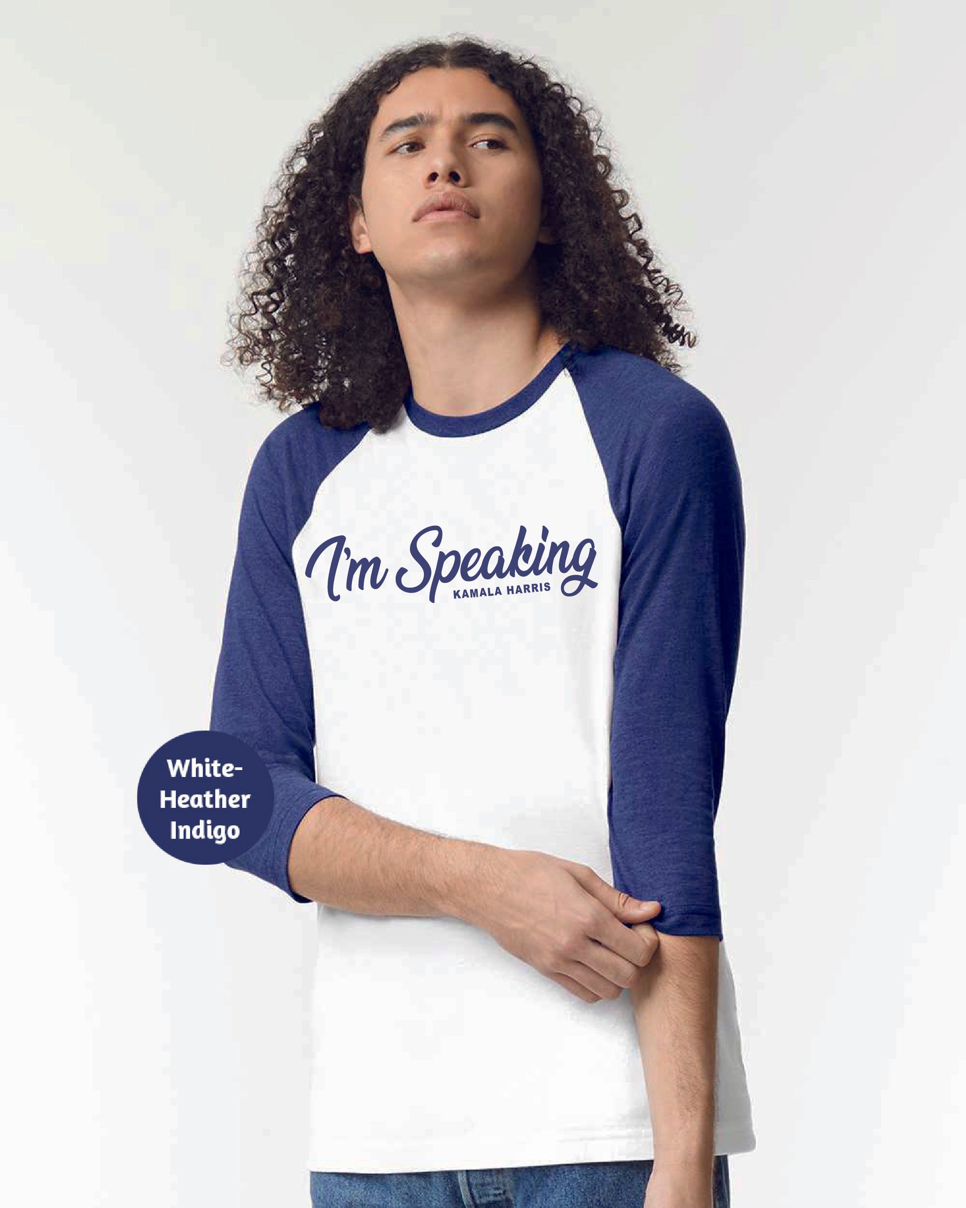 a man with long curly hair wearing a white and blue shirt