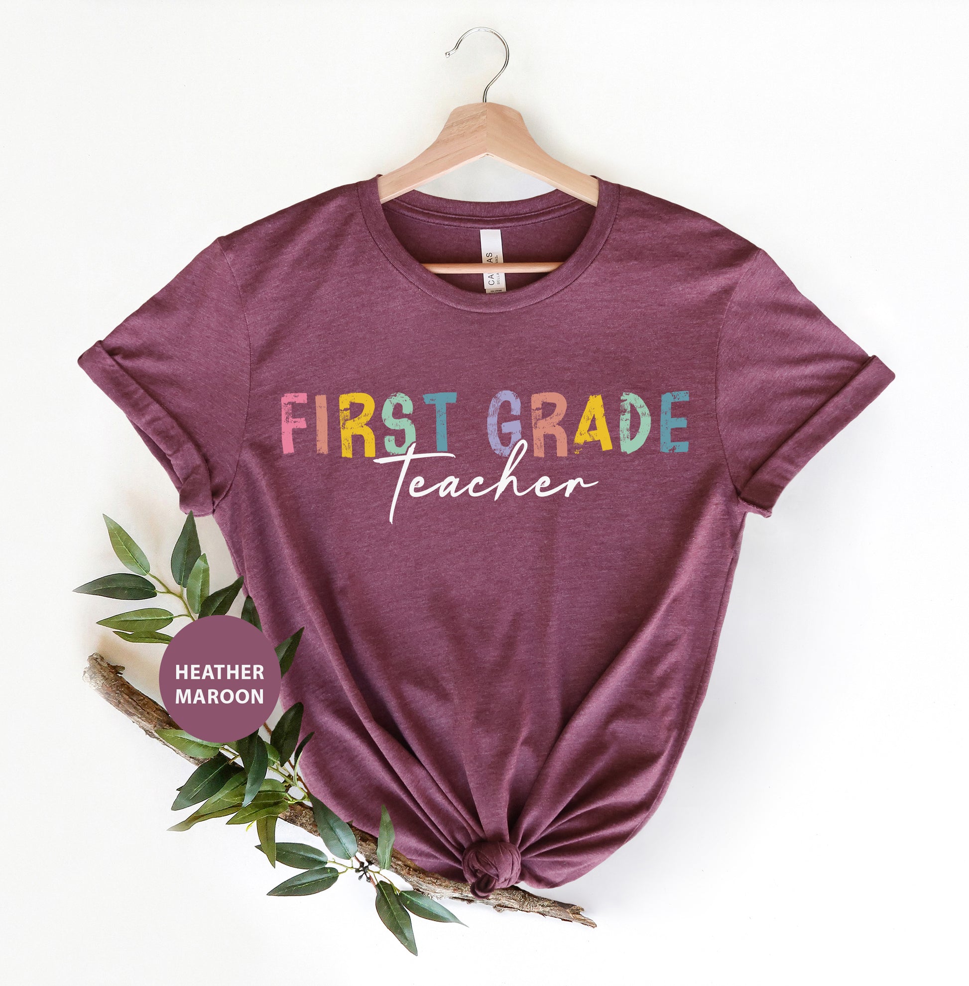 a t - shirt with the words first grade teacher on it