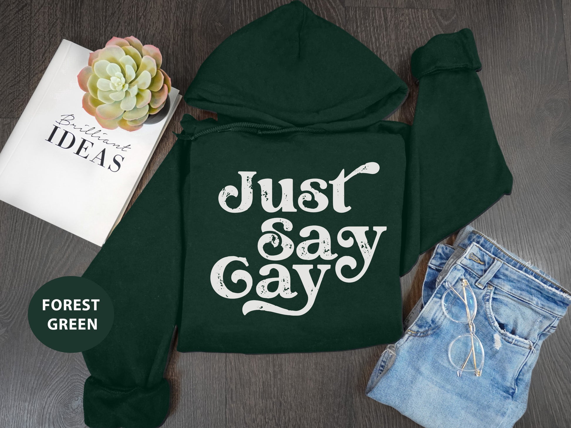 a green hoodie with the words just say gay on it