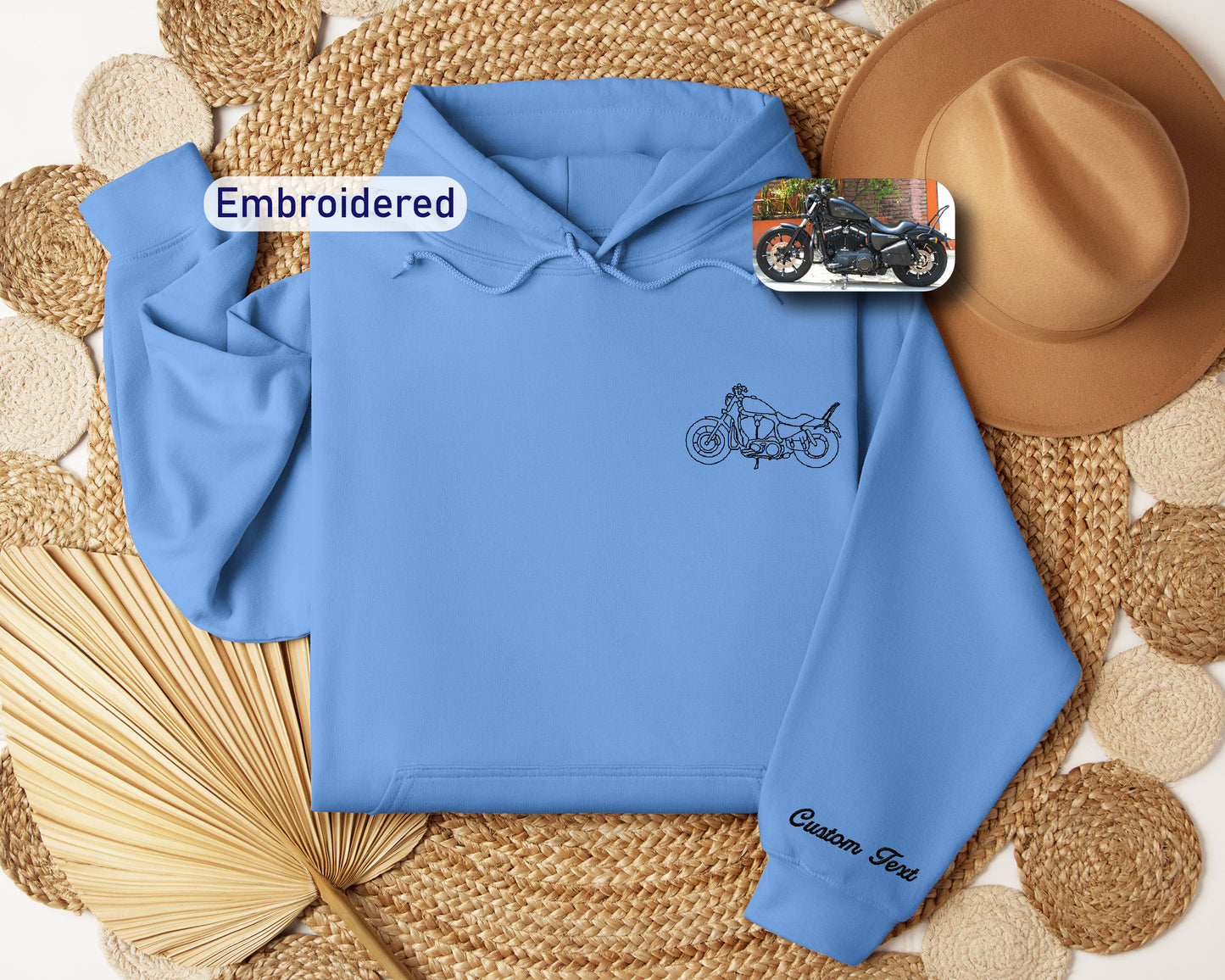 a blue hoodie with a picture of a motorcycle on it