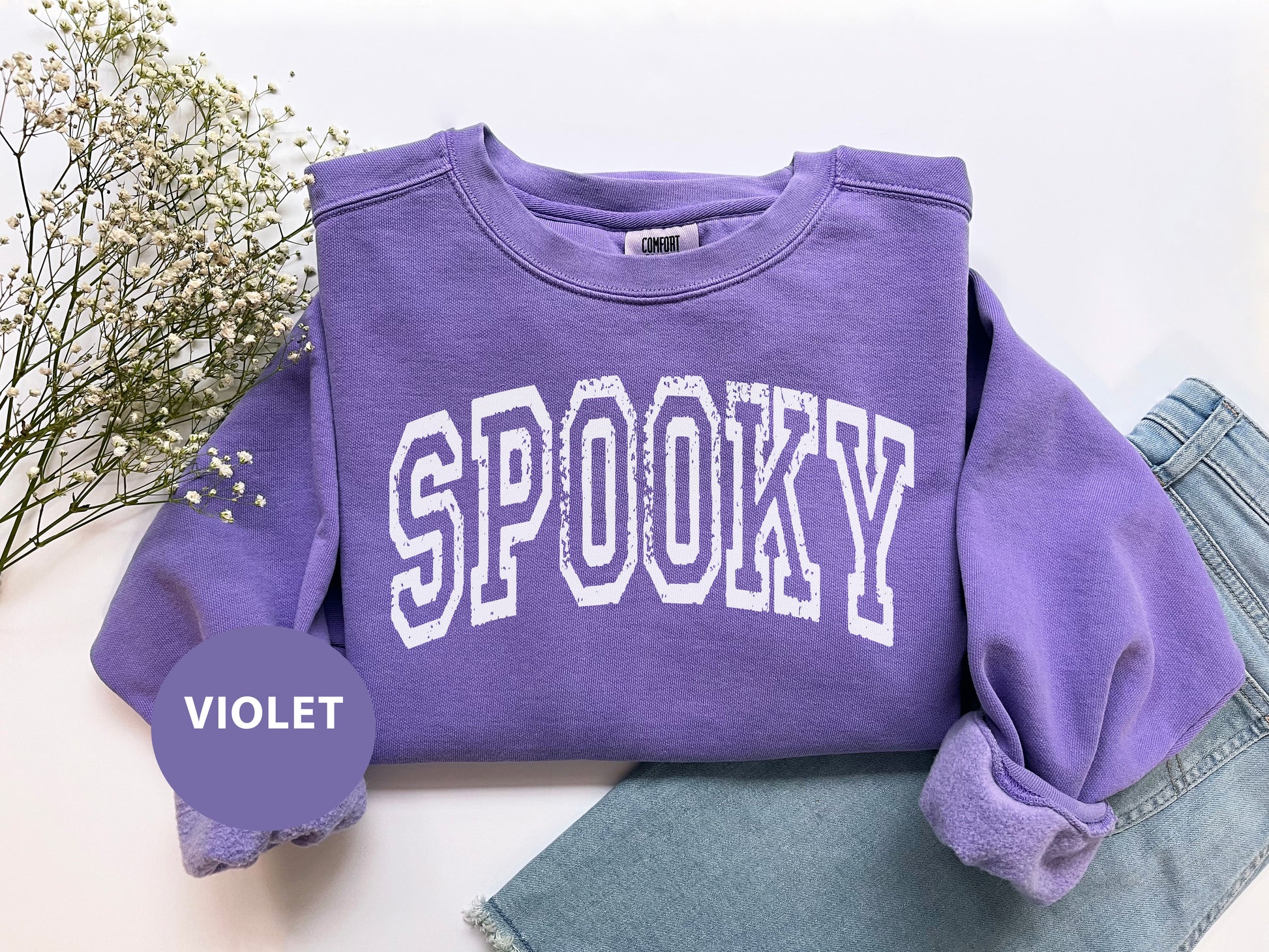 a purple shirt with the word spooky on it