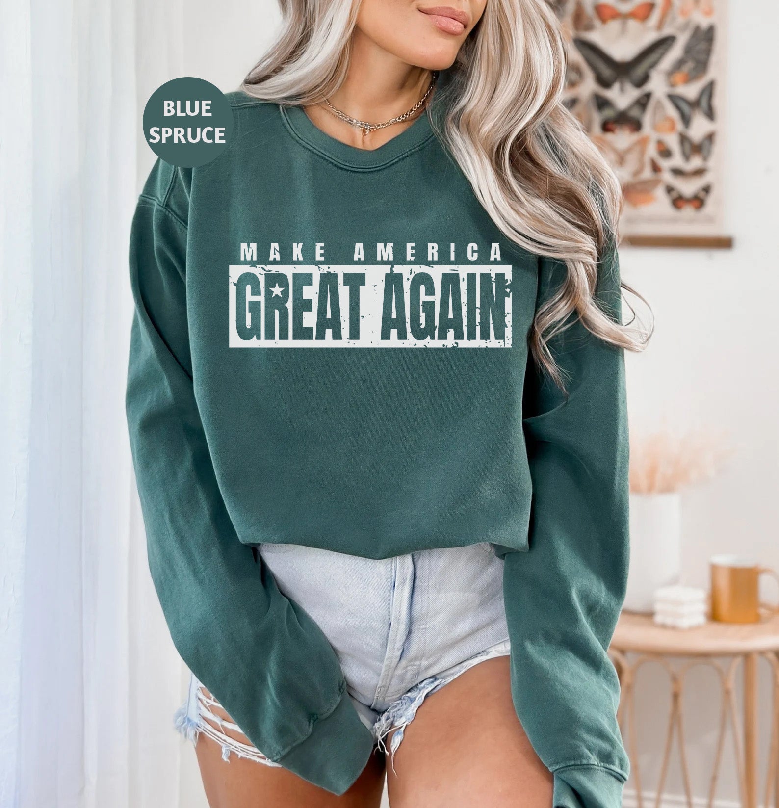 a woman wearing a green sweatshirt with the words make america great again on it