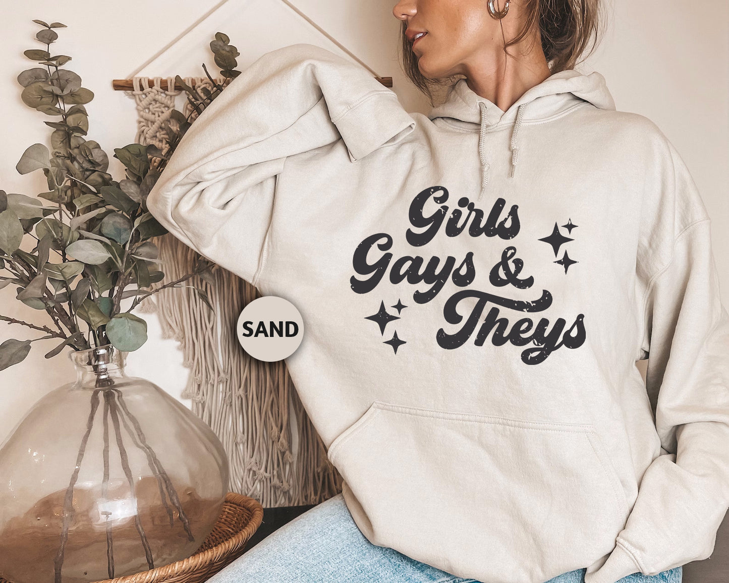 a woman wearing a white hoodie that says girls, guys and they