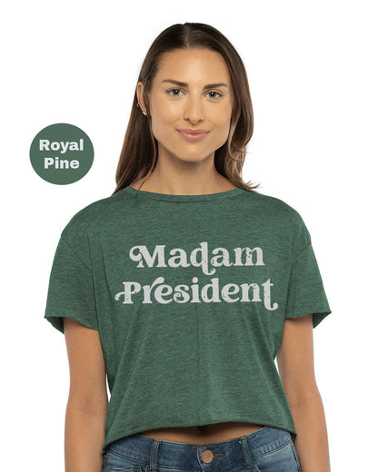 a woman wearing a green shirt that says madam president