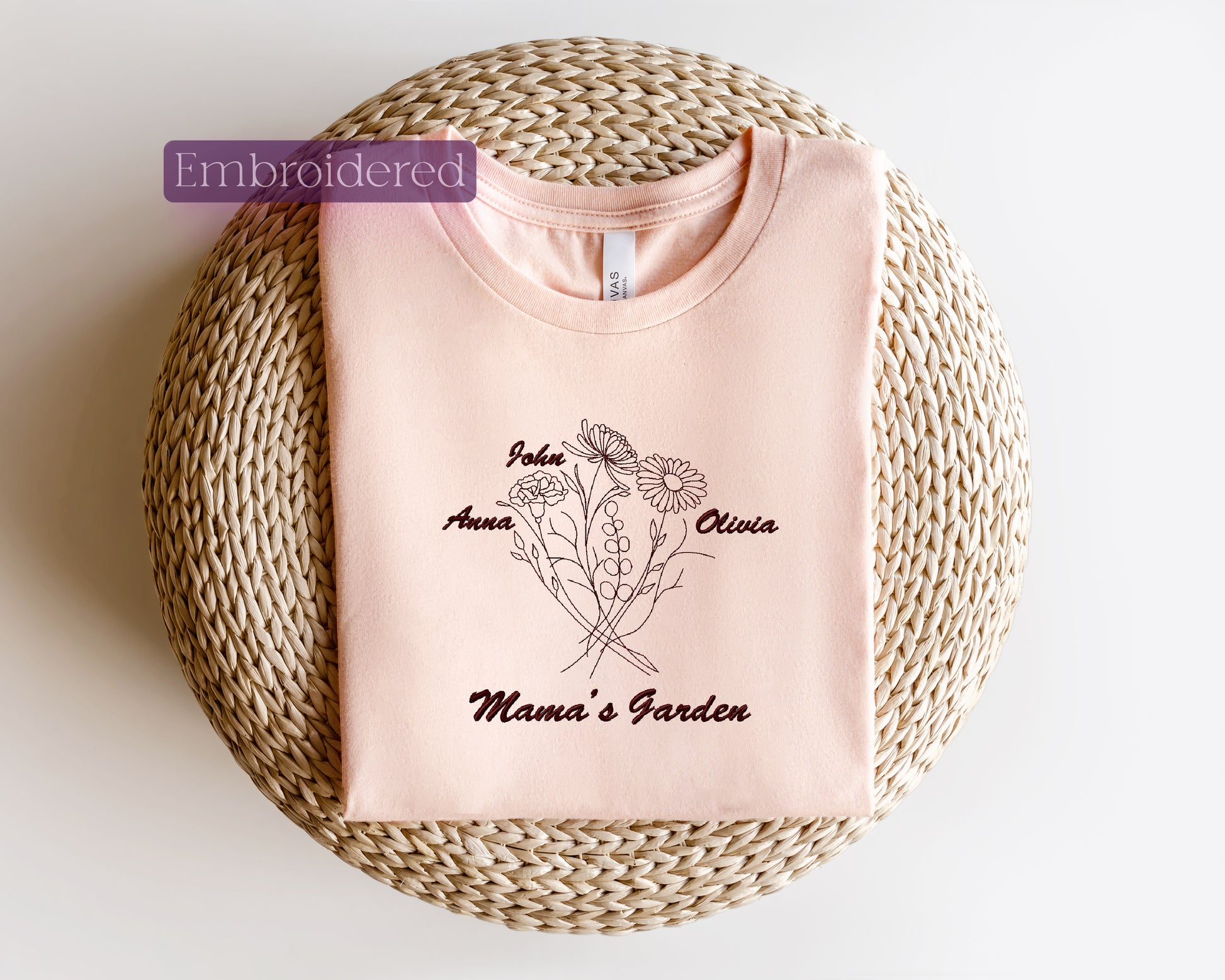 a pink t - shirt sitting on top of a wicker basket