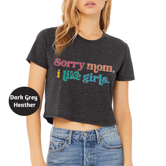 a woman wearing a t - shirt that says sorry mom, i like girls