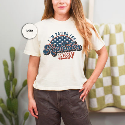 a woman standing in front of a mirror wearing a t - shirt