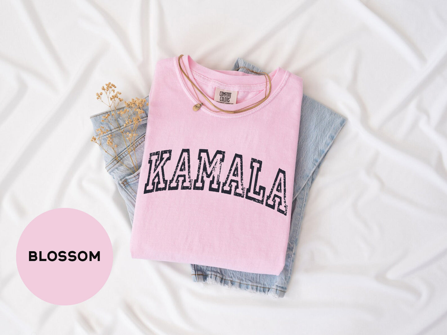 a pink shirt with the word kalamala printed on it