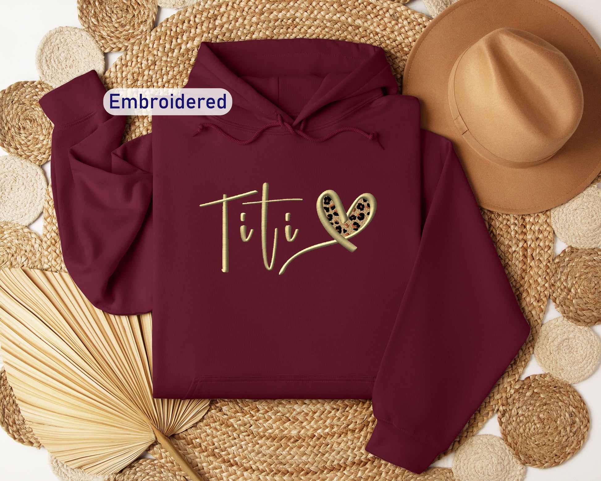 a maroon hoodie with the word tif on it