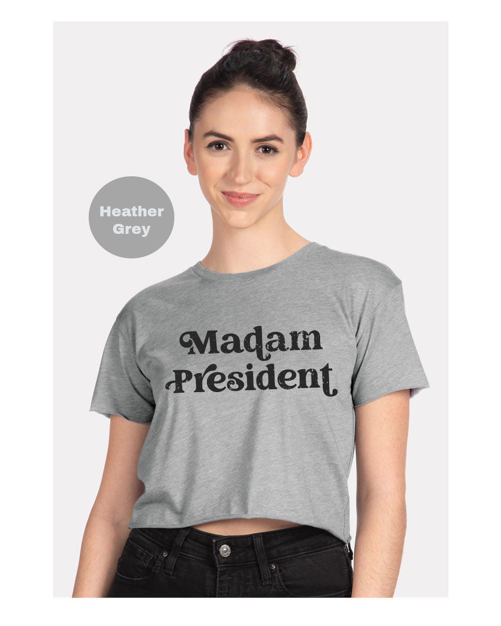 a woman wearing a grey shirt that says madam president