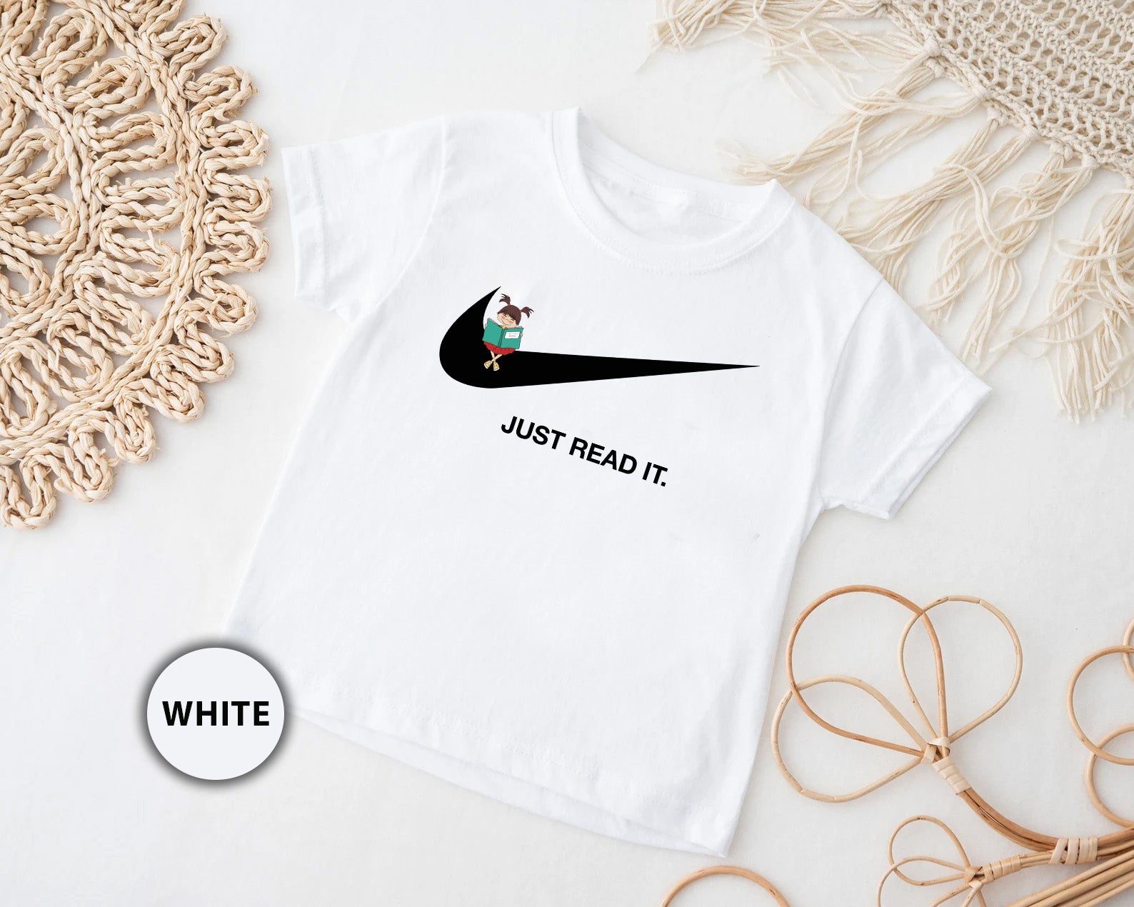 a white t - shirt with a black nike logo on it