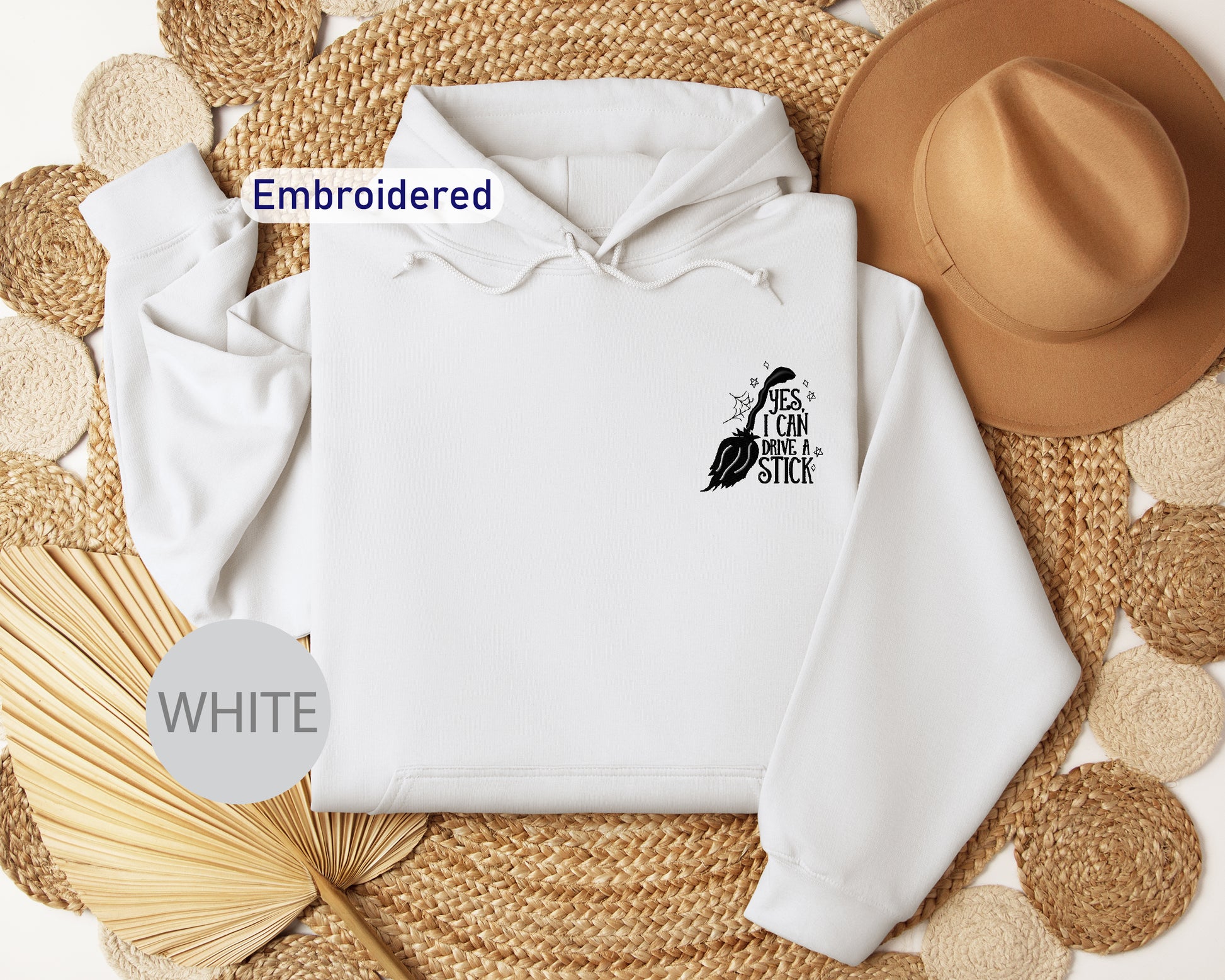 a white hoodie with the words embroidered on it