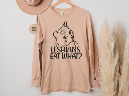 a t - shirt that says lesbians eat what? next to a hat