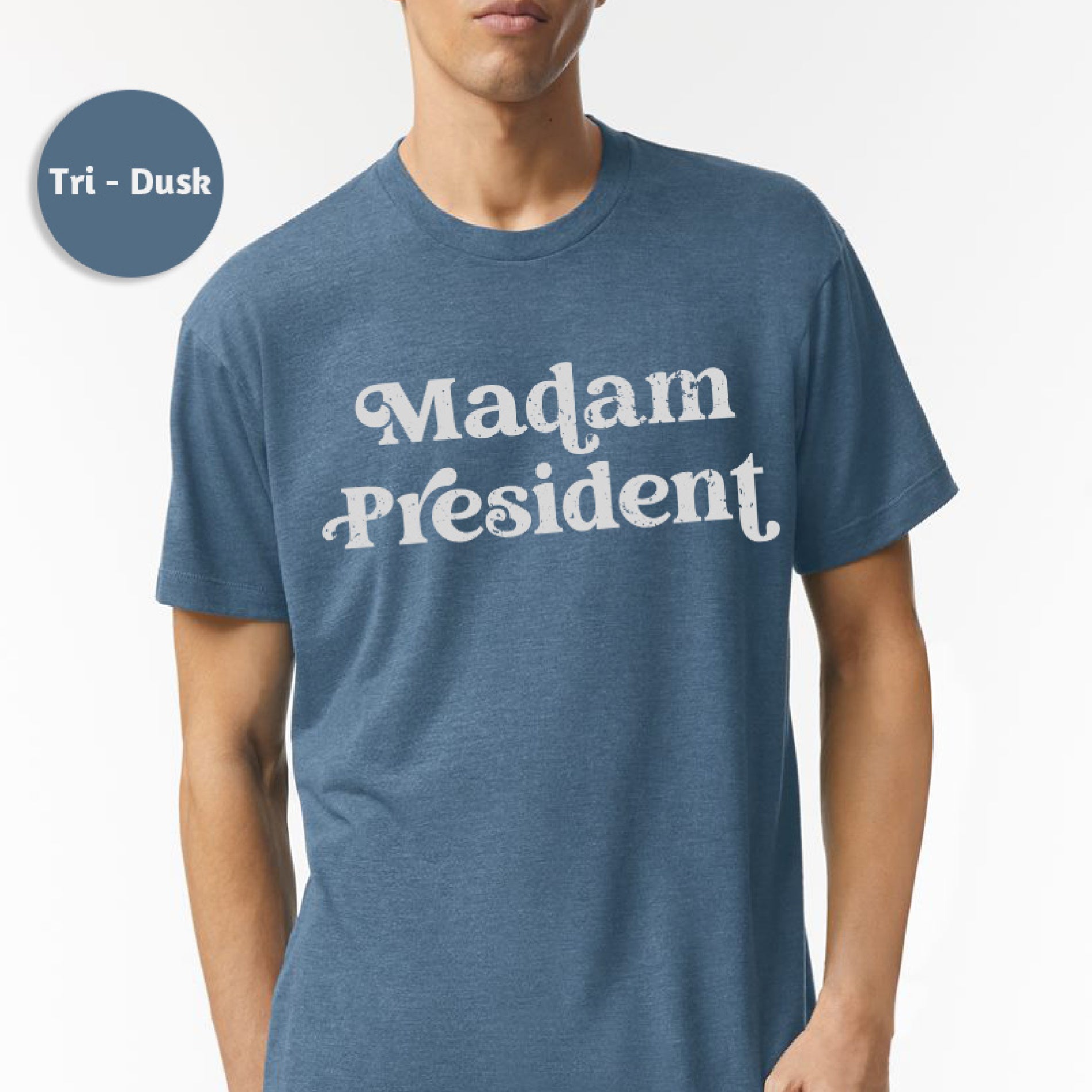 a man wearing a t - shirt that says madam president