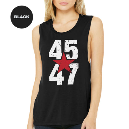 a woman wearing a black tank top with a red star on it