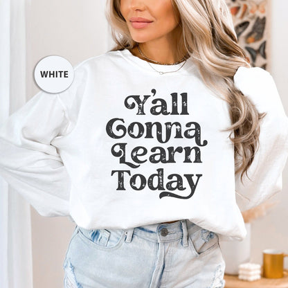 a woman wearing a sweatshirt that says y'all conna learn today