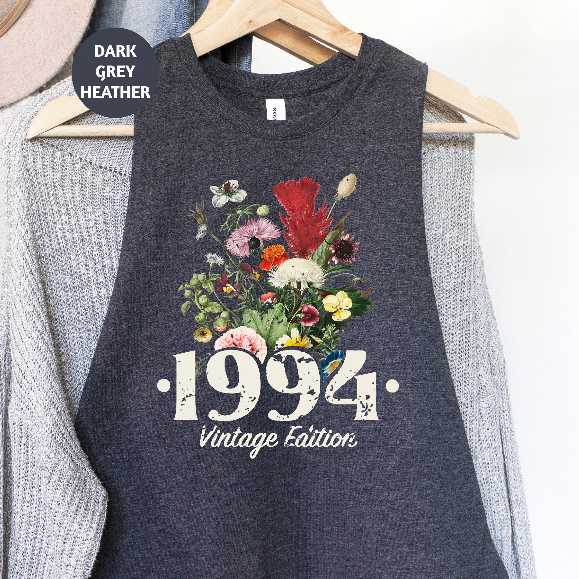 a tank top that has a picture of flowers on it