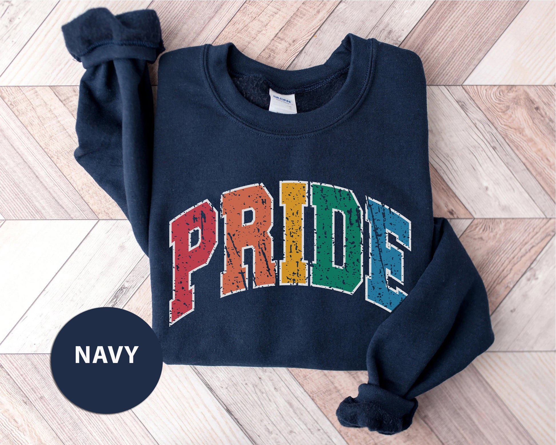 a navy sweatshirt with the word pride printed on it