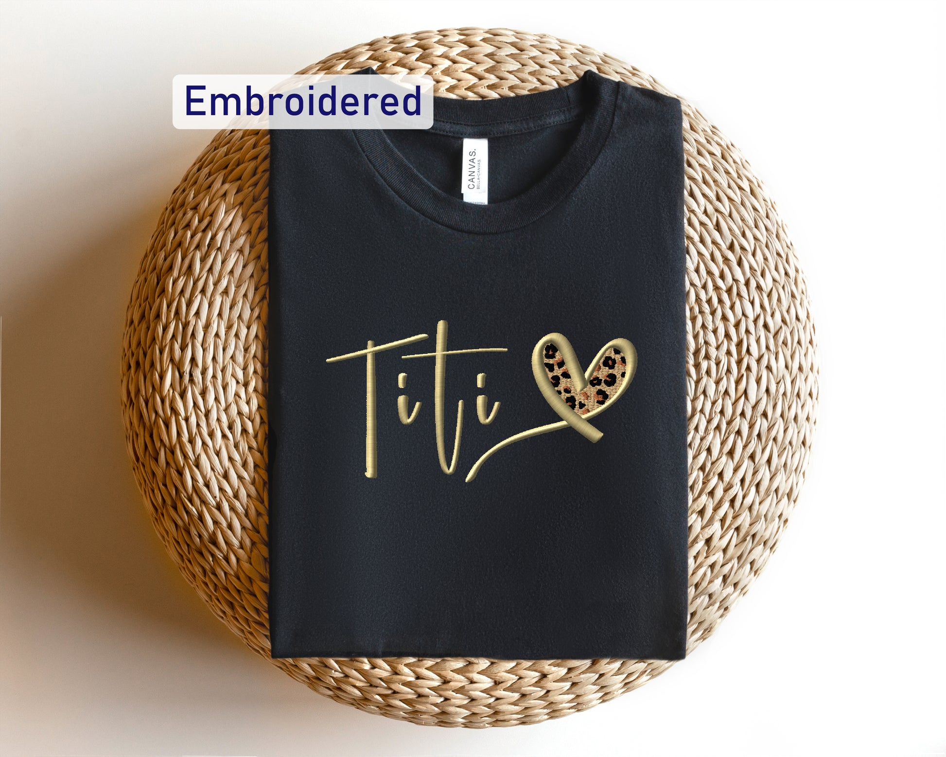 a t - shirt with the word titi written on it