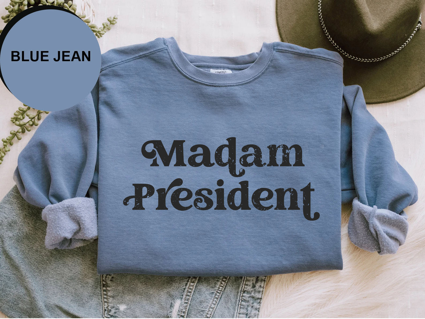 a blue jean shirt with the words madam president printed on it