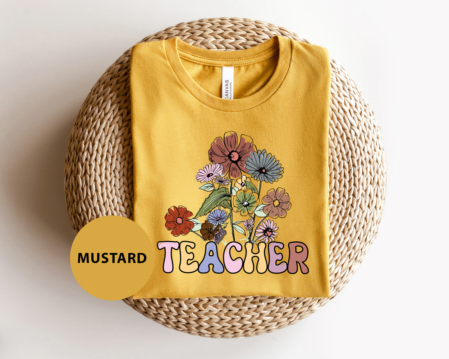 a yellow t - shirt with a picture of flowers on it