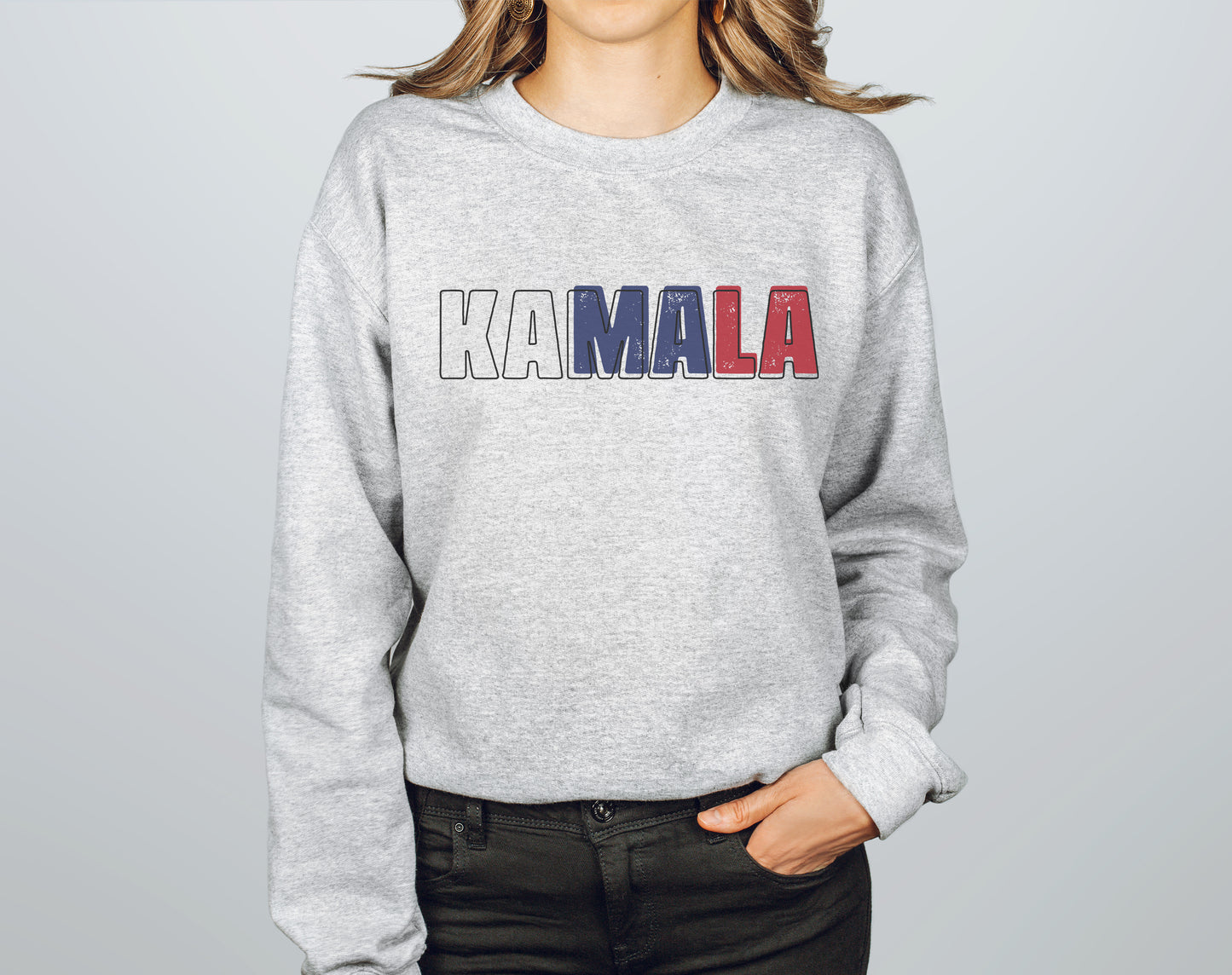 a woman wearing a sweatshirt with the word kaamala printed on it