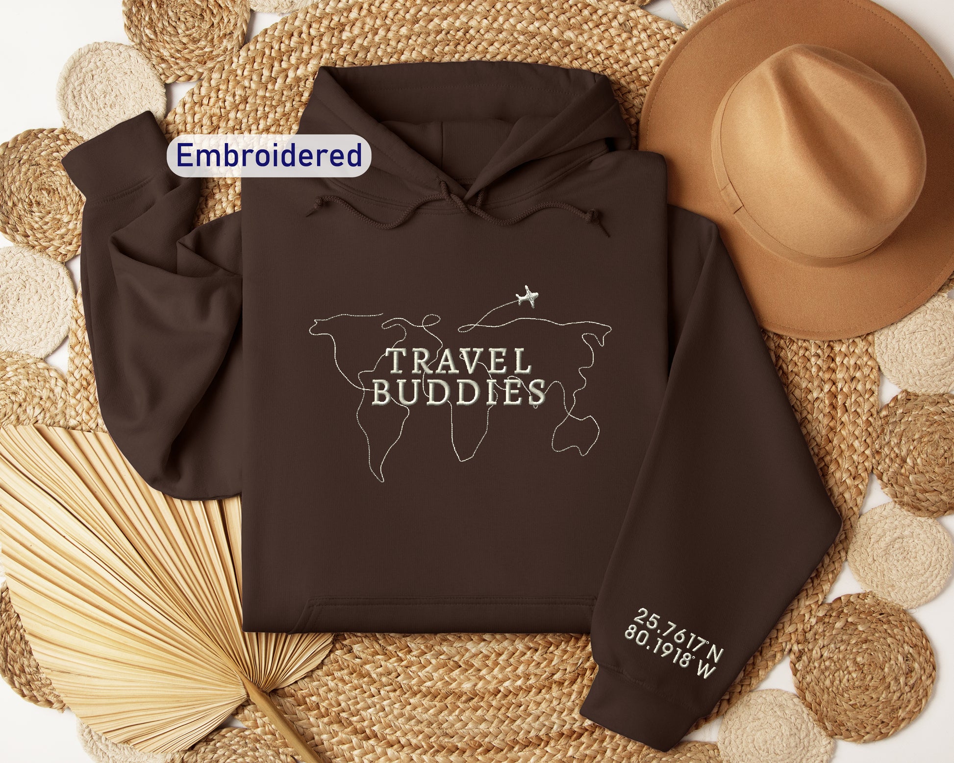 a brown hoodie with the words travel buddies on it