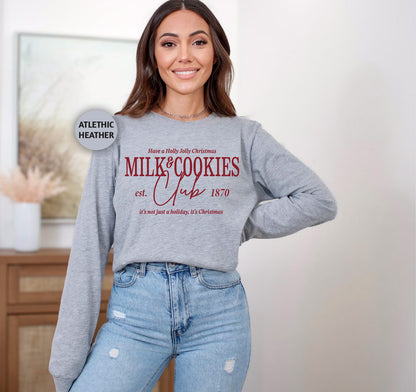 a woman wearing a sweatshirt that says milk and cookies on it