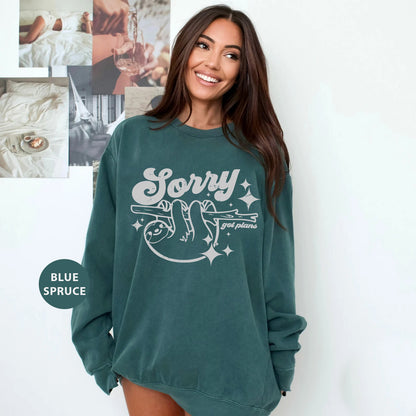 a woman in a green sweatshirt posing for a picture