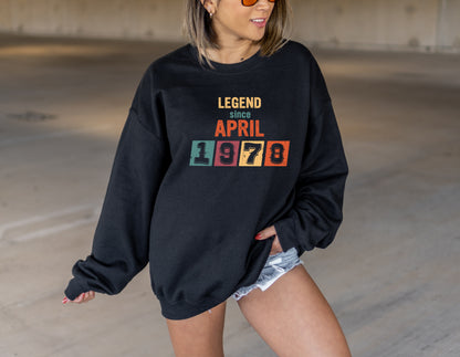 A woman wearing a black sweatshirt with the text "LEGEND since APRIL 1978" printed on it.