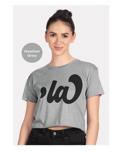 a woman wearing a grey crop top with the word'a'on it