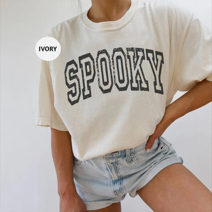 a woman wearing a shirt that says spooky