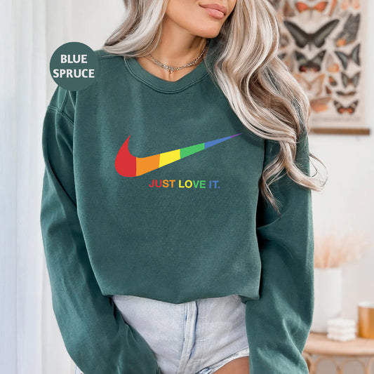 a woman wearing a green sweatshirt with the words just love it on it