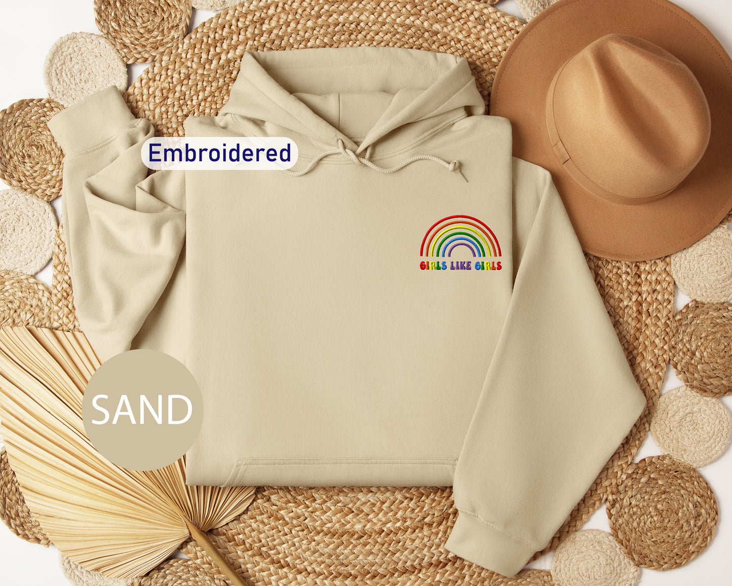 a white hoodie with a rainbow embroidered on it