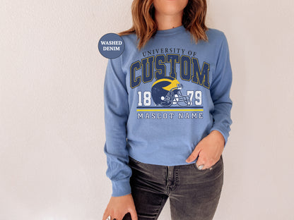 a woman wearing a sweatshirt with a football helmet on it