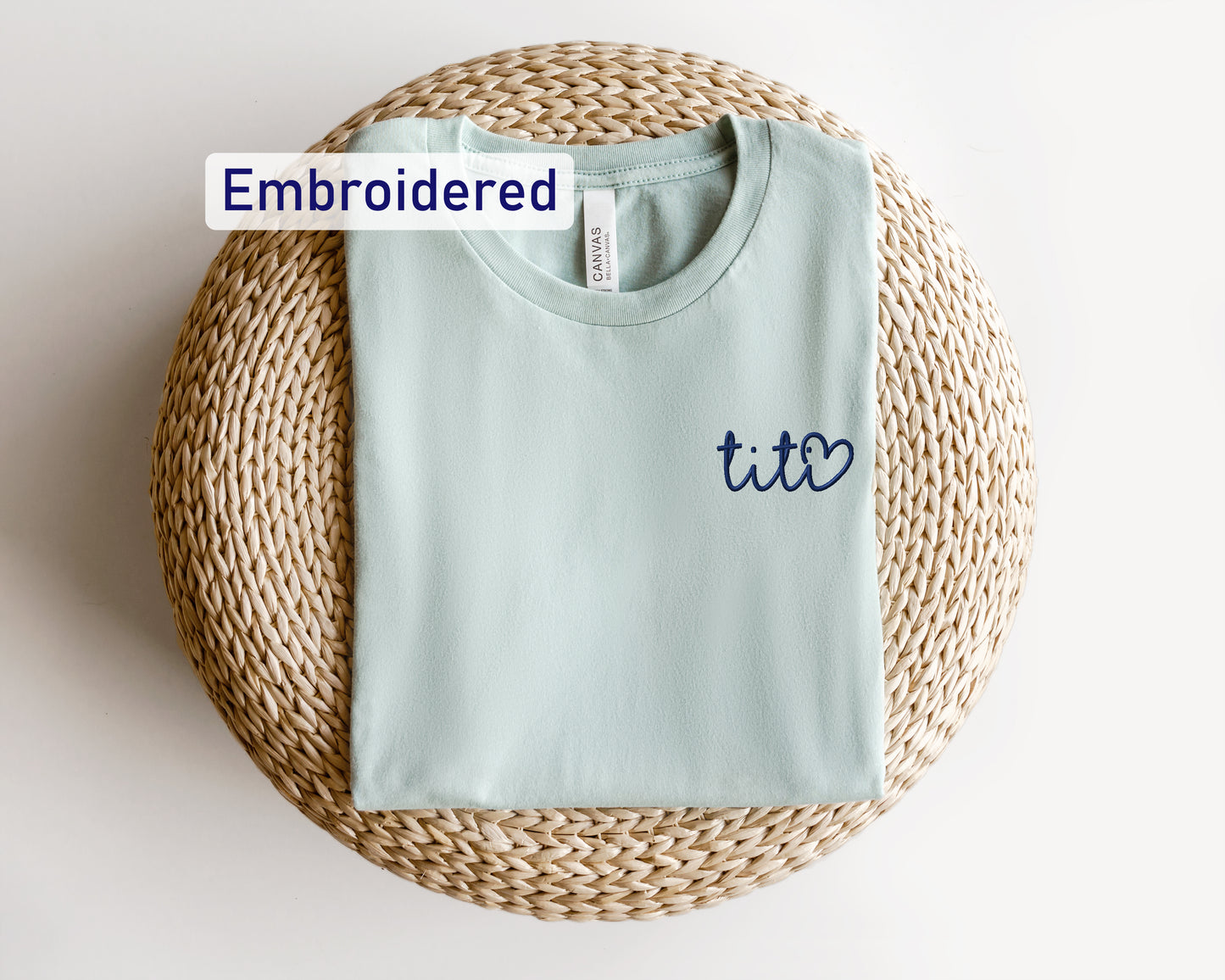 a t - shirt with the word embroidered on it