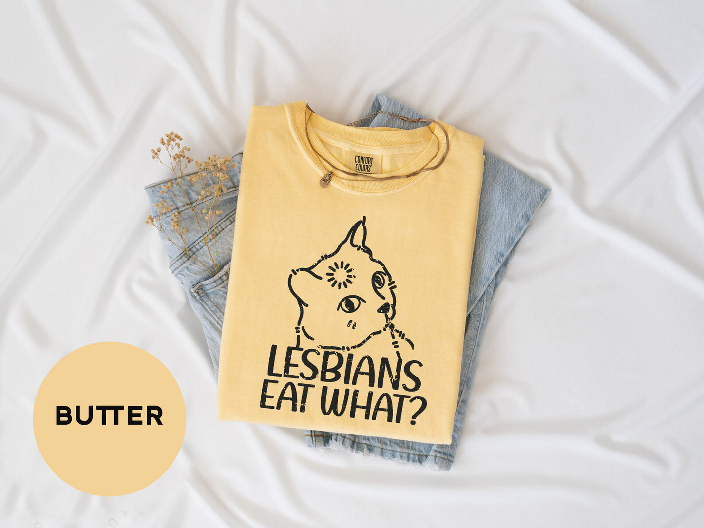 a t - shirt that says lesbians eat what on it