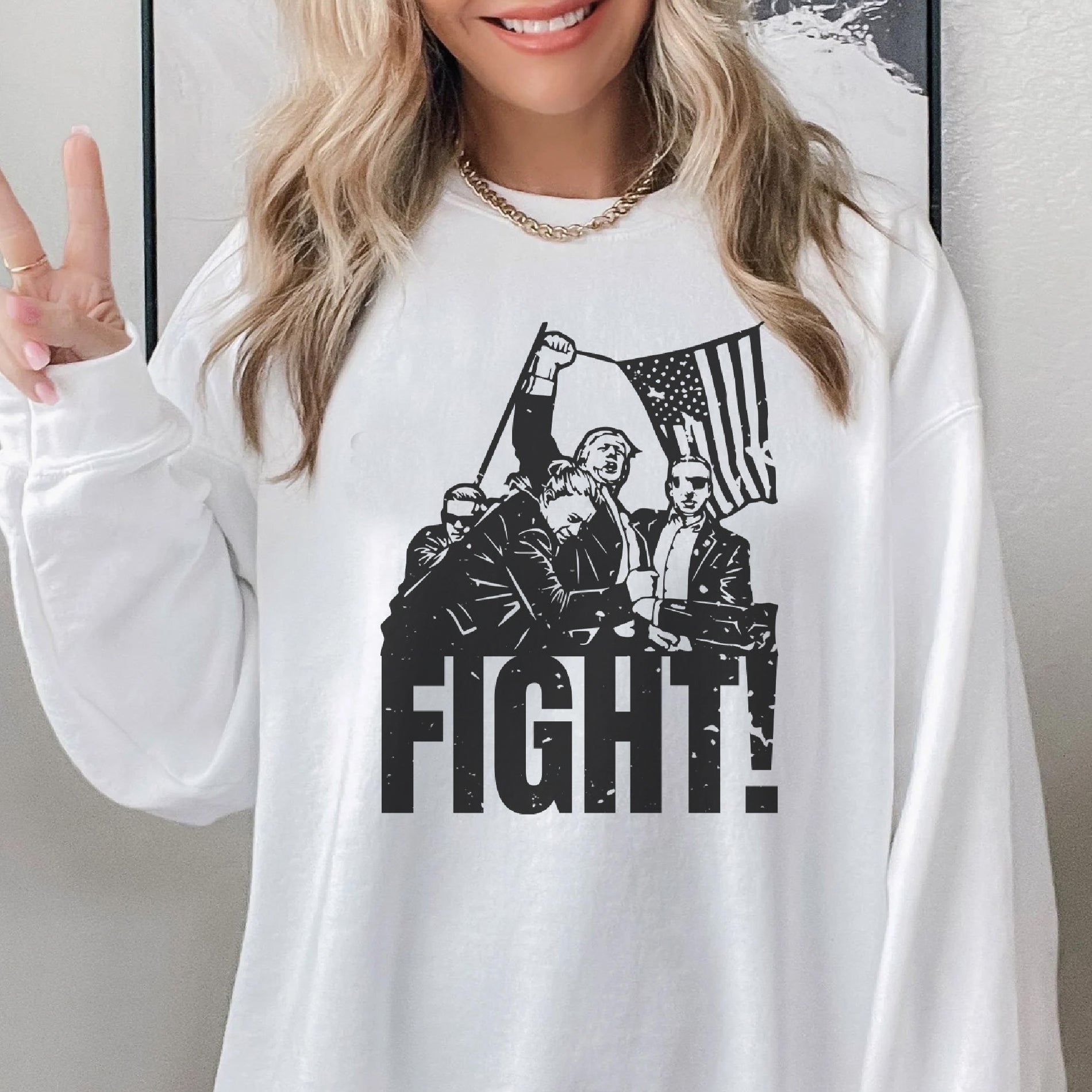 a woman wearing a white shirt that says fight