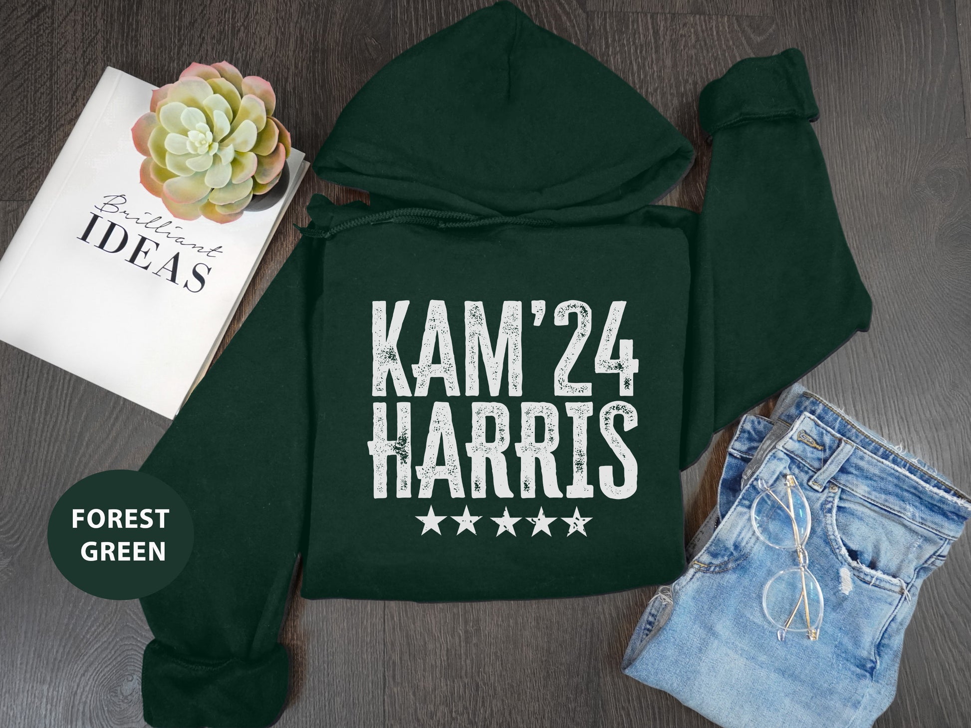 a green hoodie with a pair of shorts and a book