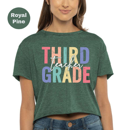 a woman wearing a green shirt that says third grade