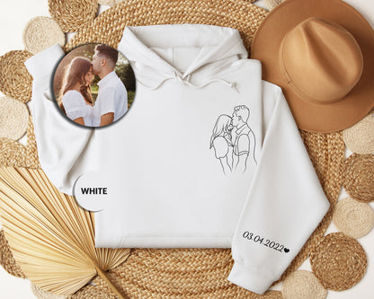 a white hoodie with a picture of a couple on it