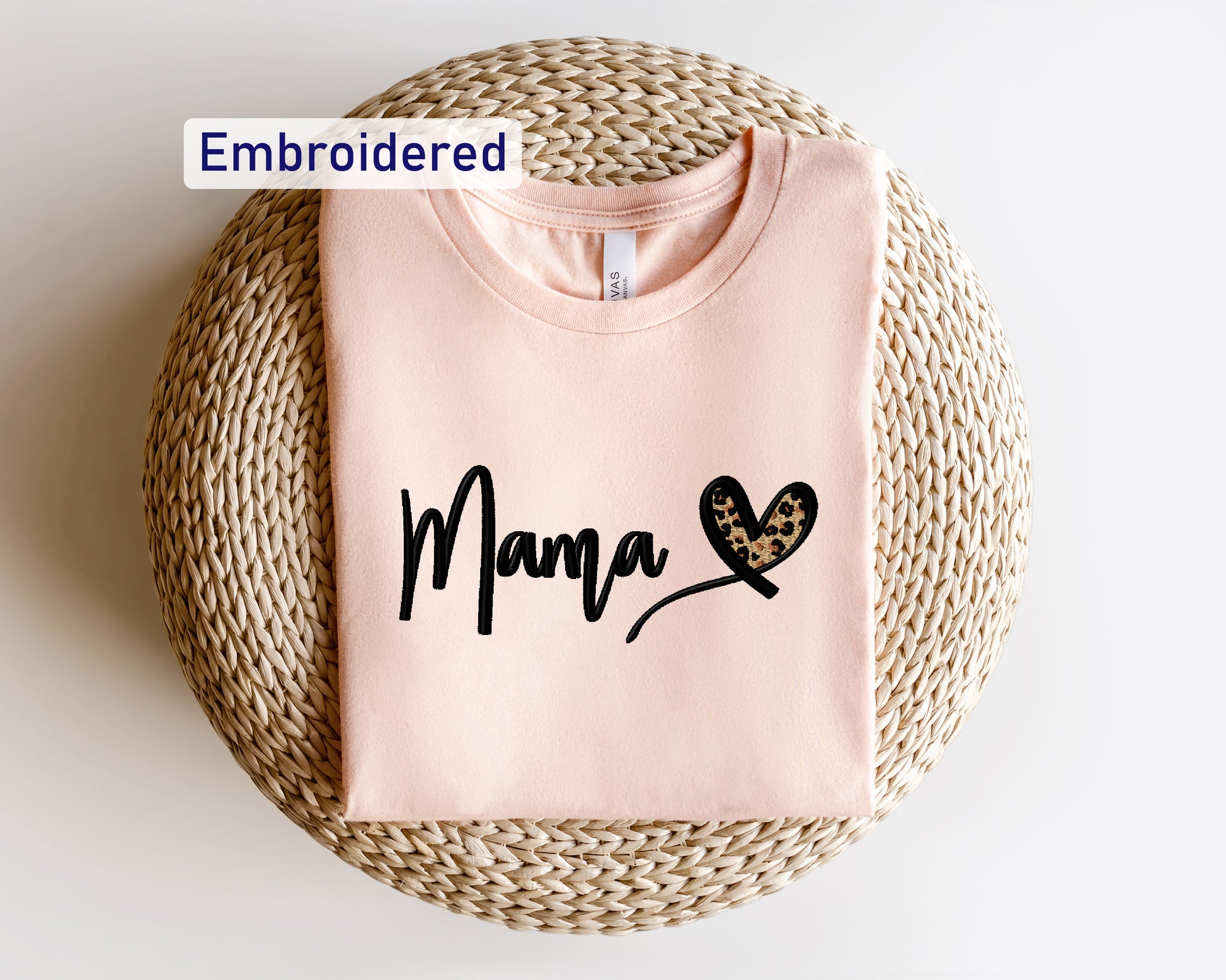 a pink shirt with the word mama written on it