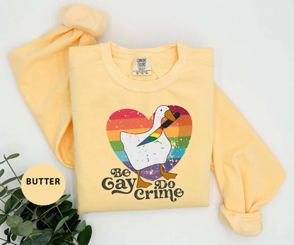 a yellow sweatshirt with a white goose on it