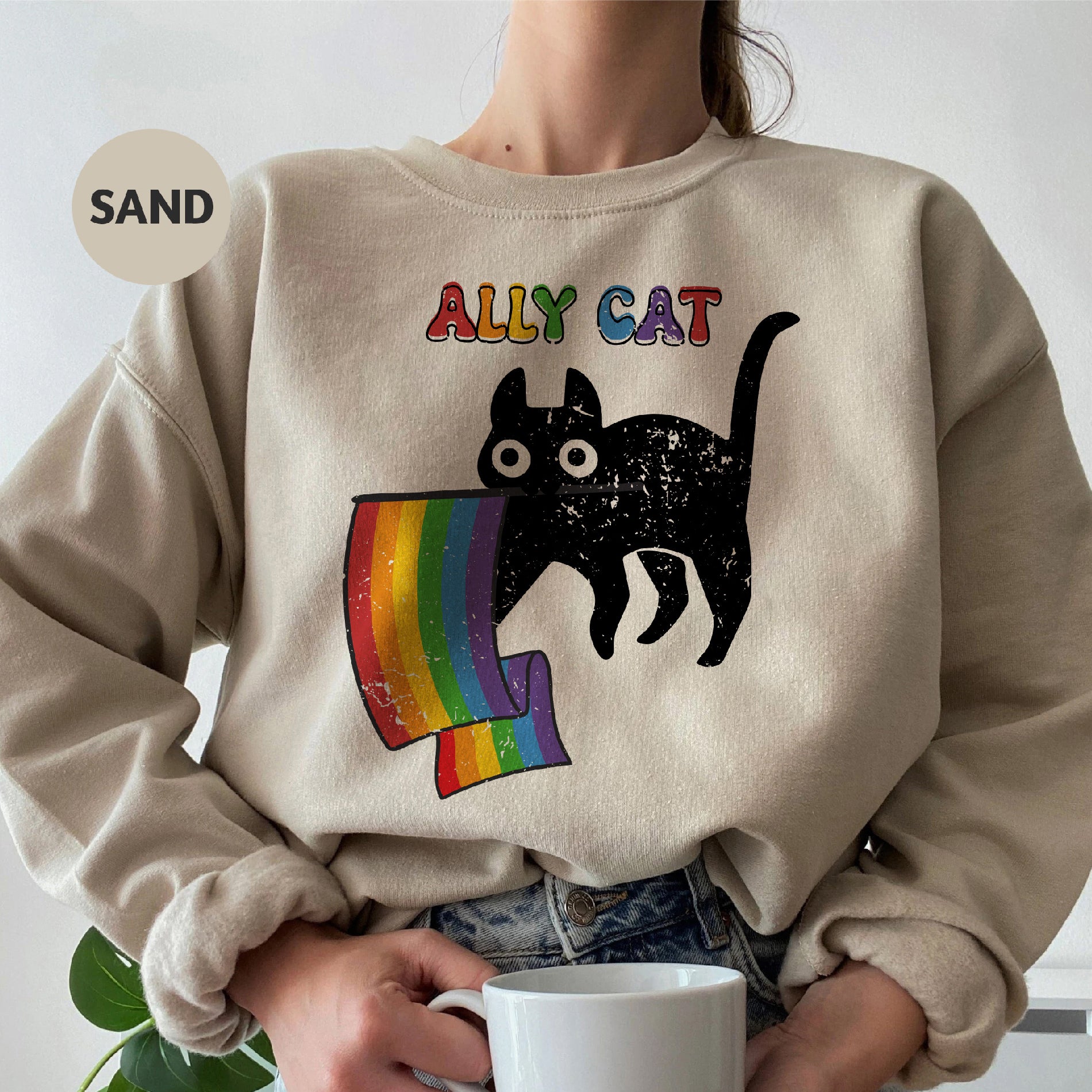 a woman wearing a sweatshirt with a cat on it