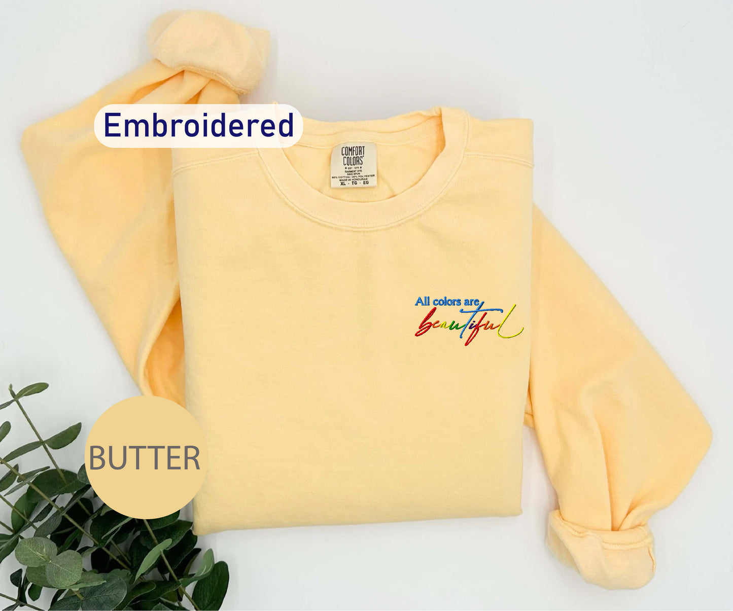 a yellow sweatshirt with the words butter on it