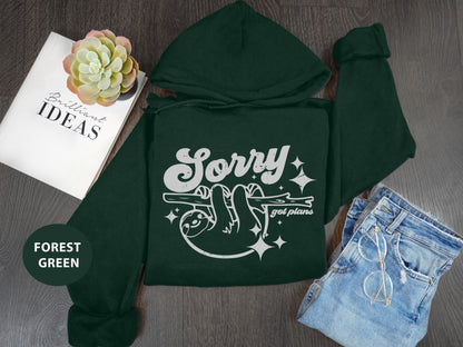 a green hoodie with the words sorry on it