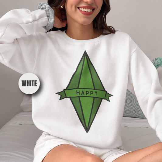 a woman sitting on a bed wearing a white happy sweatshirt